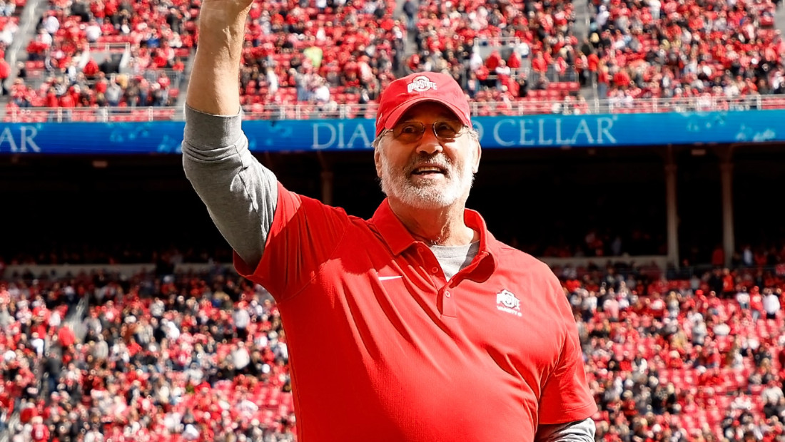Ohio State Alumni Rick Middleton on the football field waving to a crowd