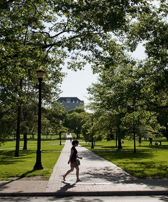 a student walking on the OSU oval