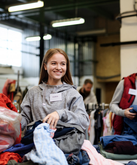volunteers-sorting-out-donated-clothes-in-communit