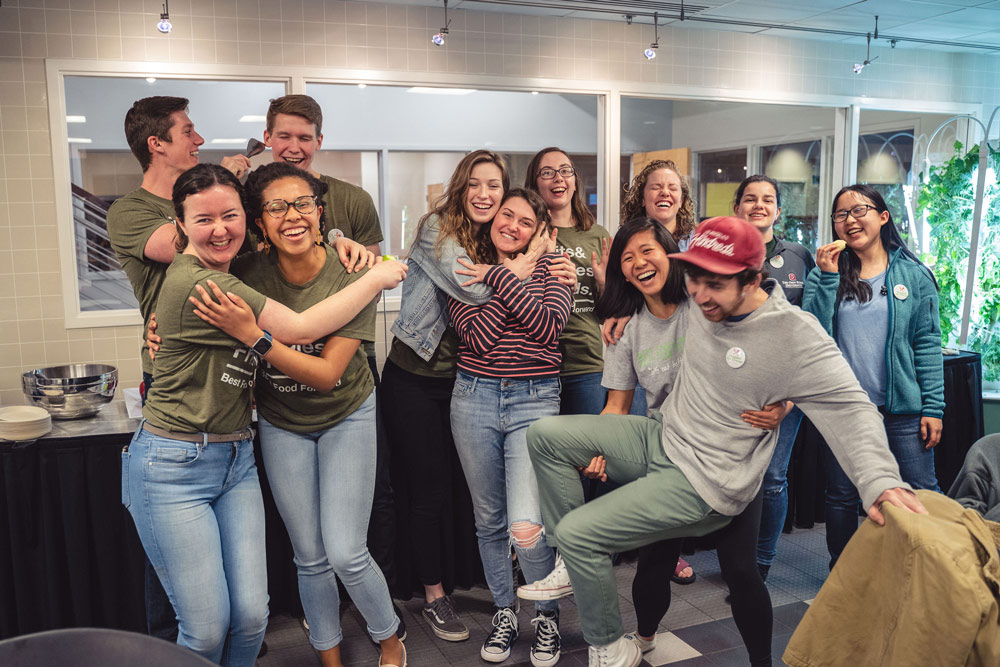 Ohio State students apart of nutrition group Best Food Forward laugh and embrace