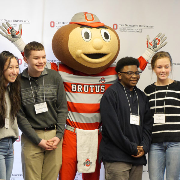 High school students pose with Brutus Buckeye mascot