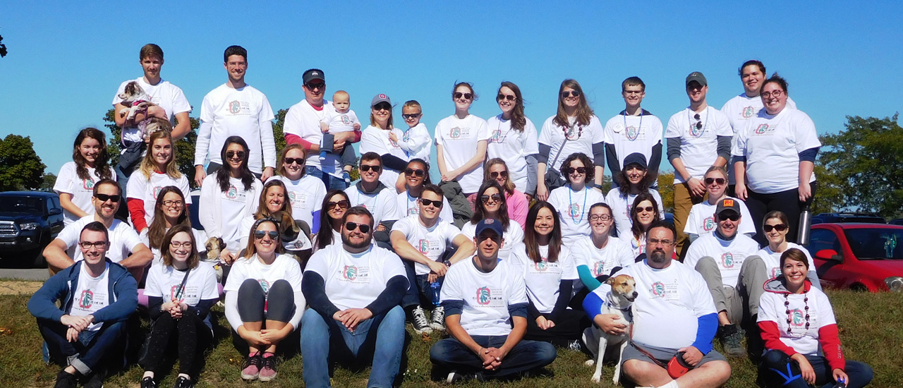 Group of people gather together before the start of a walk to fund raise for suicide prevention