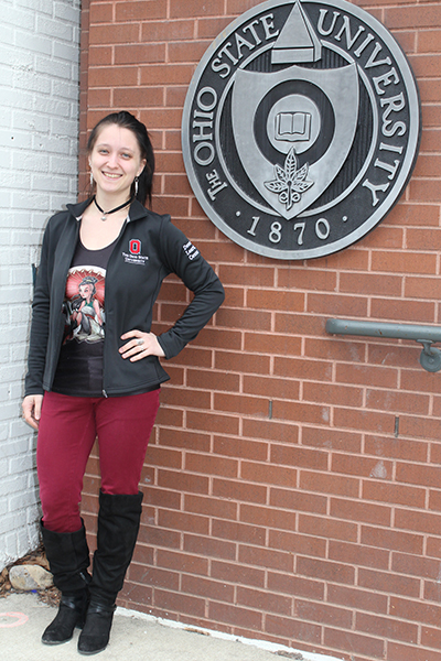 Irina Kuznetcova stands outside of a building on the Columbus campus