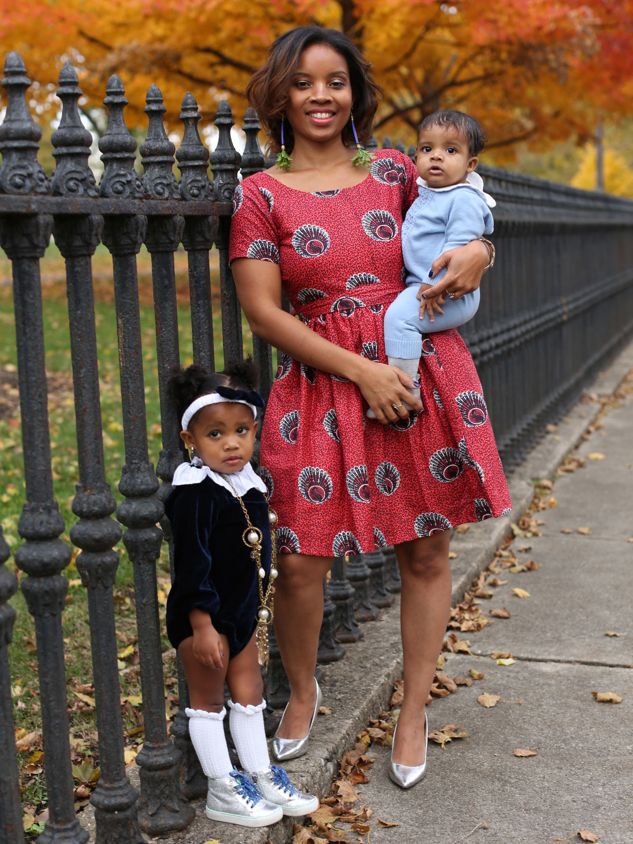 Carlotta Penn poses in a park with her two children.
