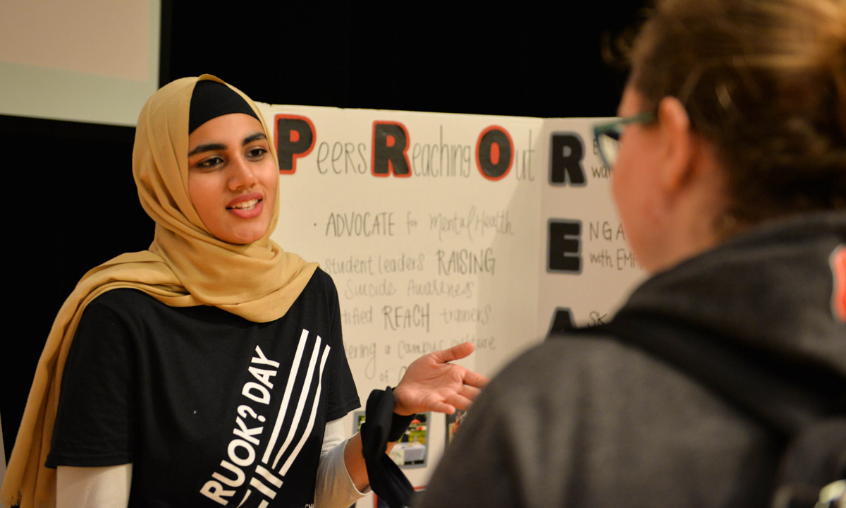 Woman in hijab speaks to Ohio State student about suicide prevention program, Peers Reaching Out