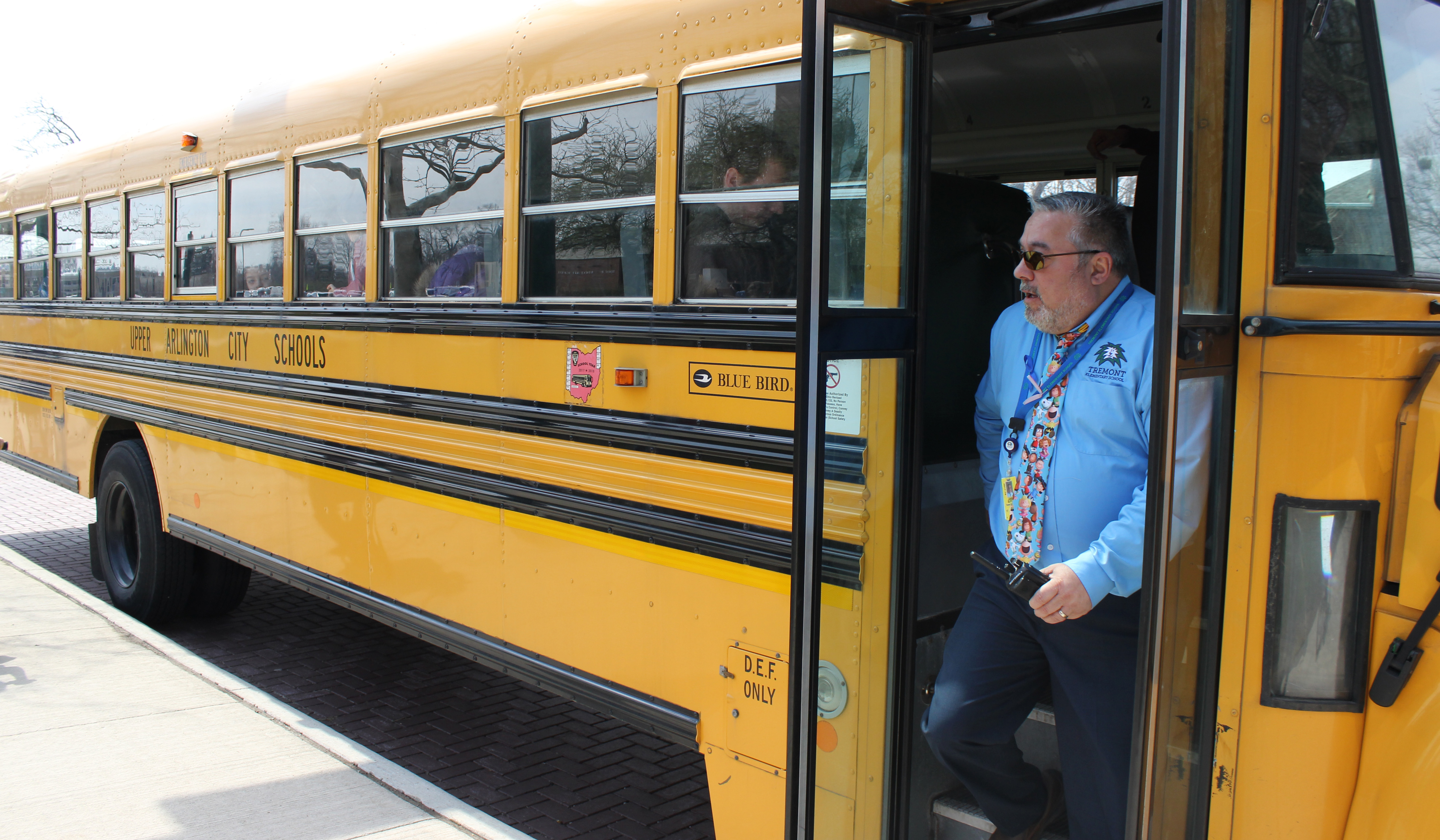 Principal Jim Buffer steps off a bus at the end of the school day.