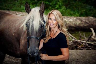Nancy Radebaugh standing next to her horse, Missy