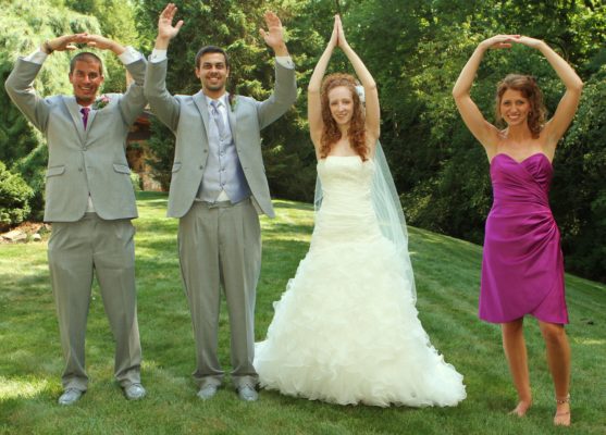 Alumna Jennifer Glasbrenner and her wedding party spell out O-H-I-O