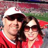 Jeff Gibson and wife Kareena Gibson at football game.
