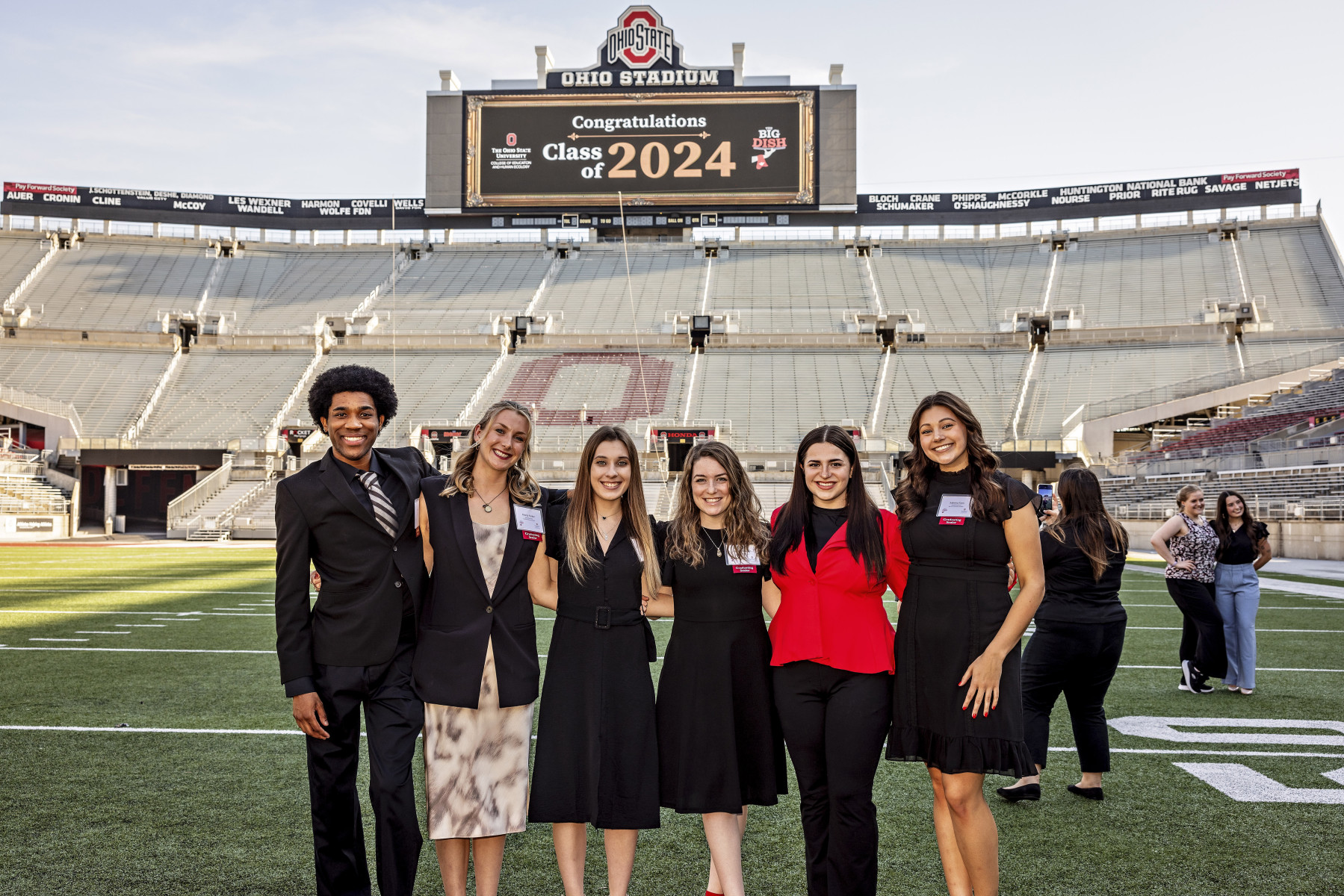 Big Dish event planning committee on the Ohio State football field