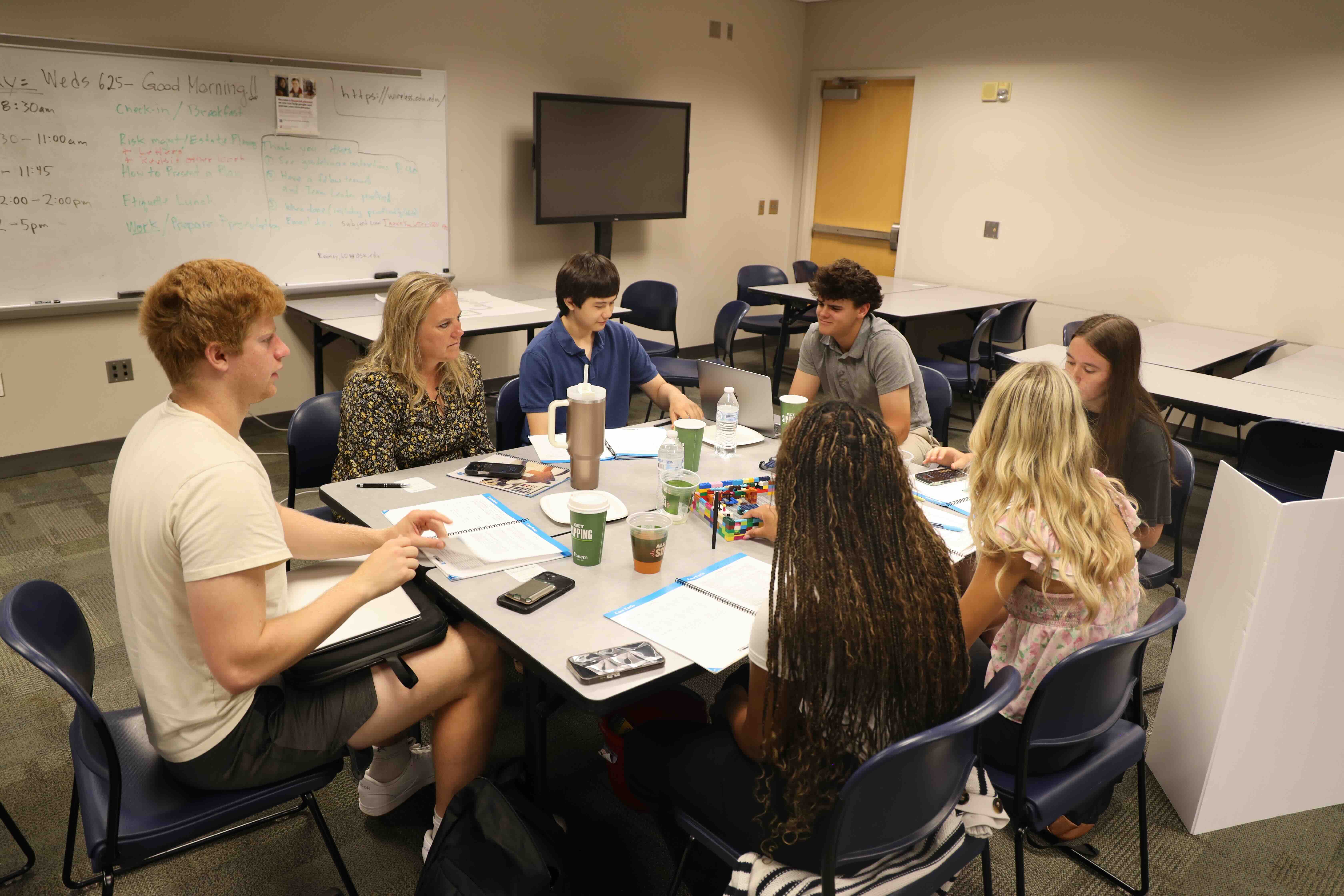 Lori Eisel and Collins Applegate with students