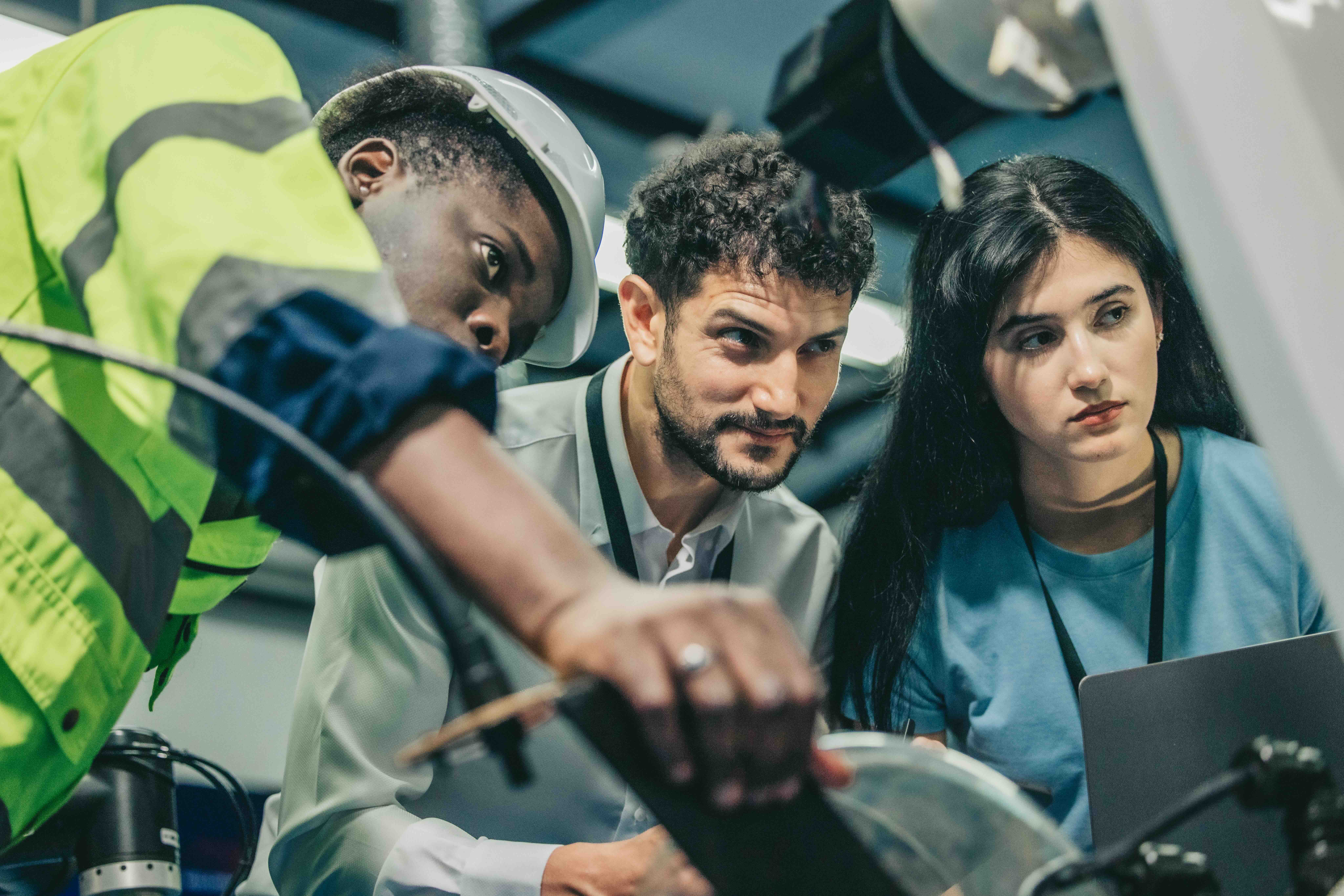 workforce team oversee machine project