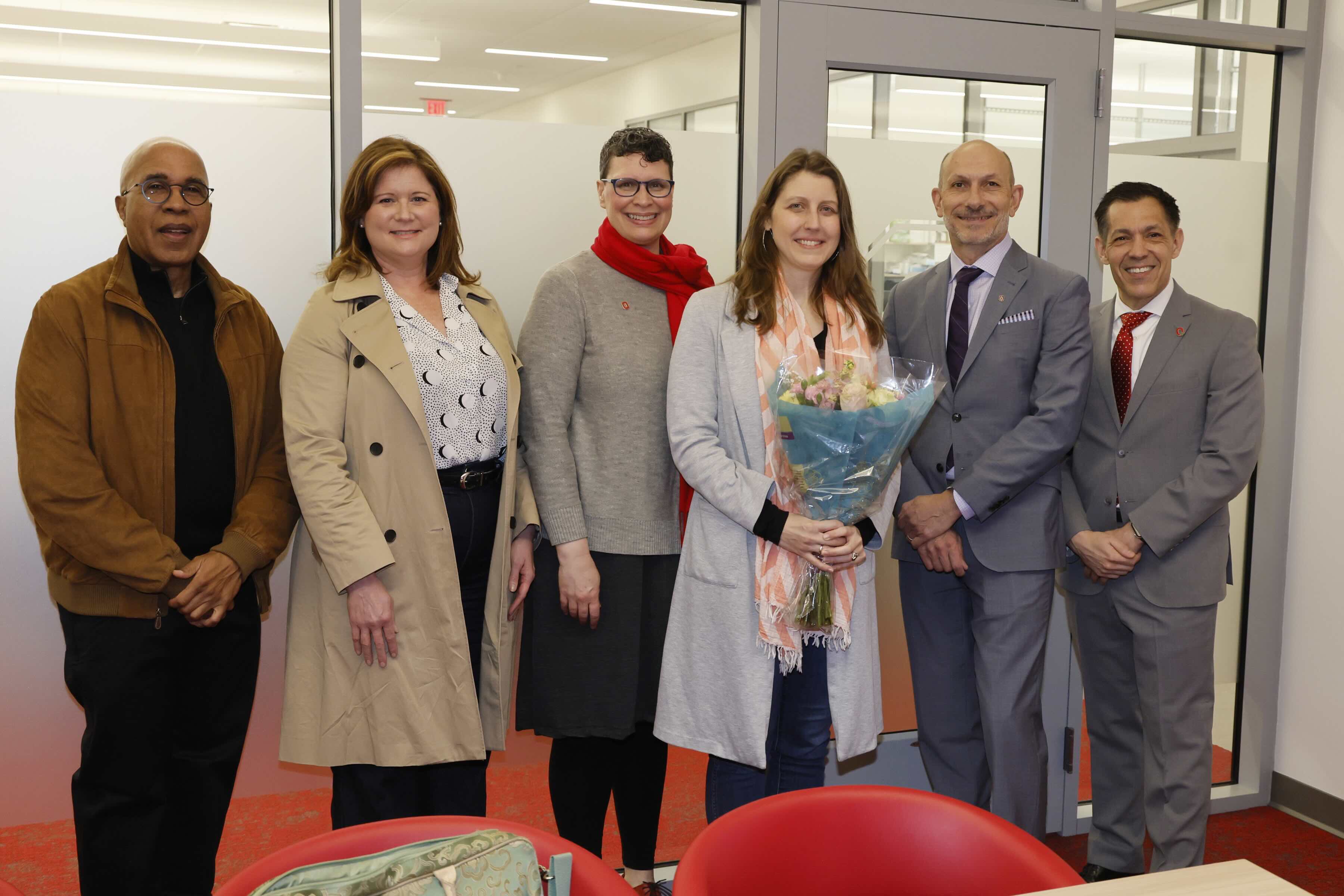 Professor Kopec receives an award from other Ohio State faculty