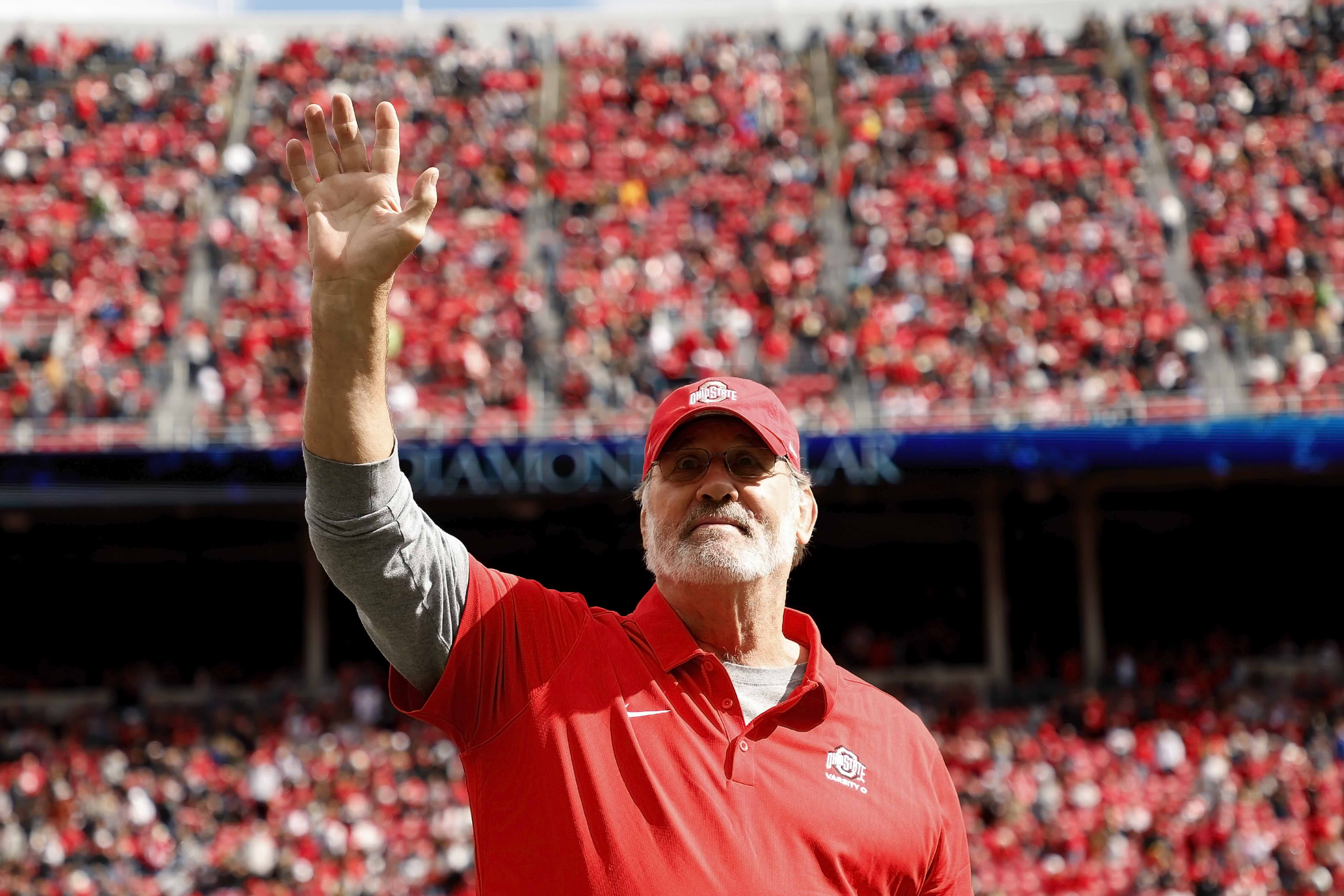 Ohio State alumni Rick Middleton waving to crowd on football field