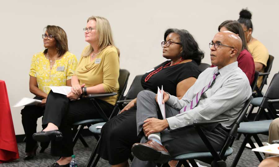 People listen to remarks during an open house for Ohio State's CETE