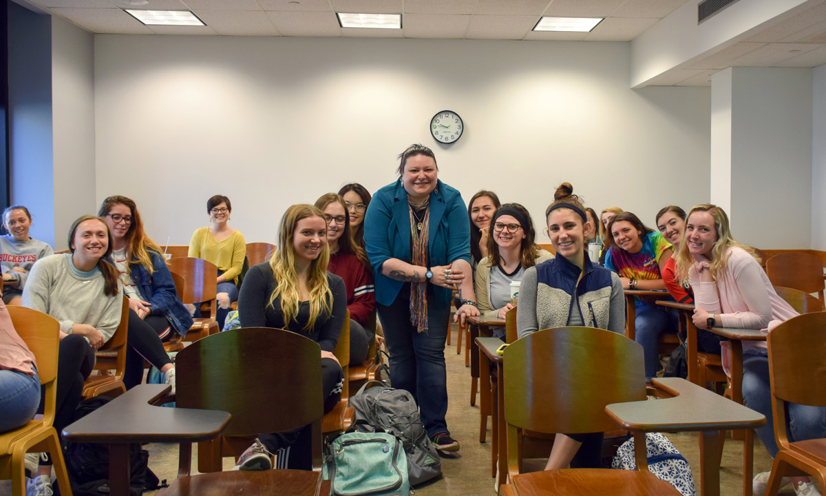 Doctoral student Sin Guanci stands with her students. She won a Graduate Associate Teaching Award from Ohio State.