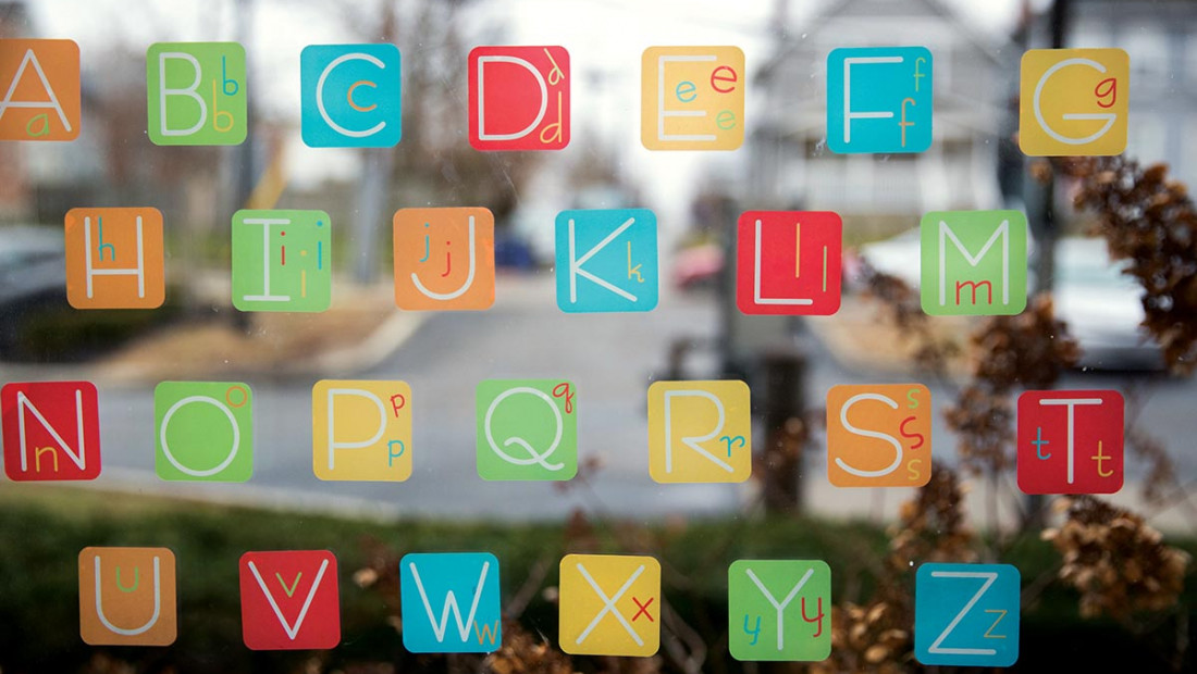 Alphabet sticky notes on a window