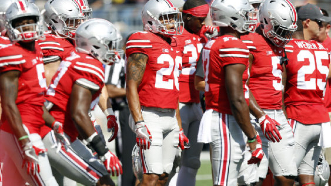 a group of football players standing next to each other