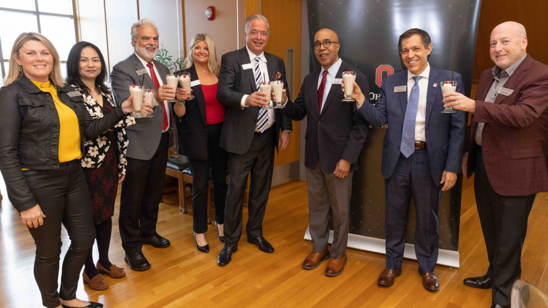 Group celebrating with milkshakes