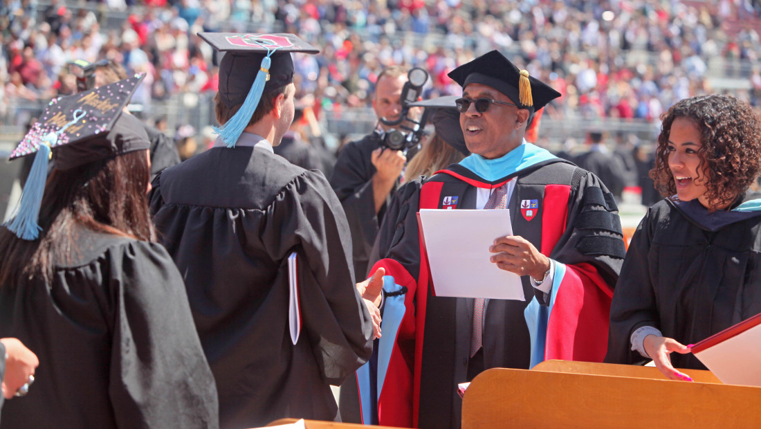 Dean Don Pope-Davis at Ohio State graduation handing out diploma