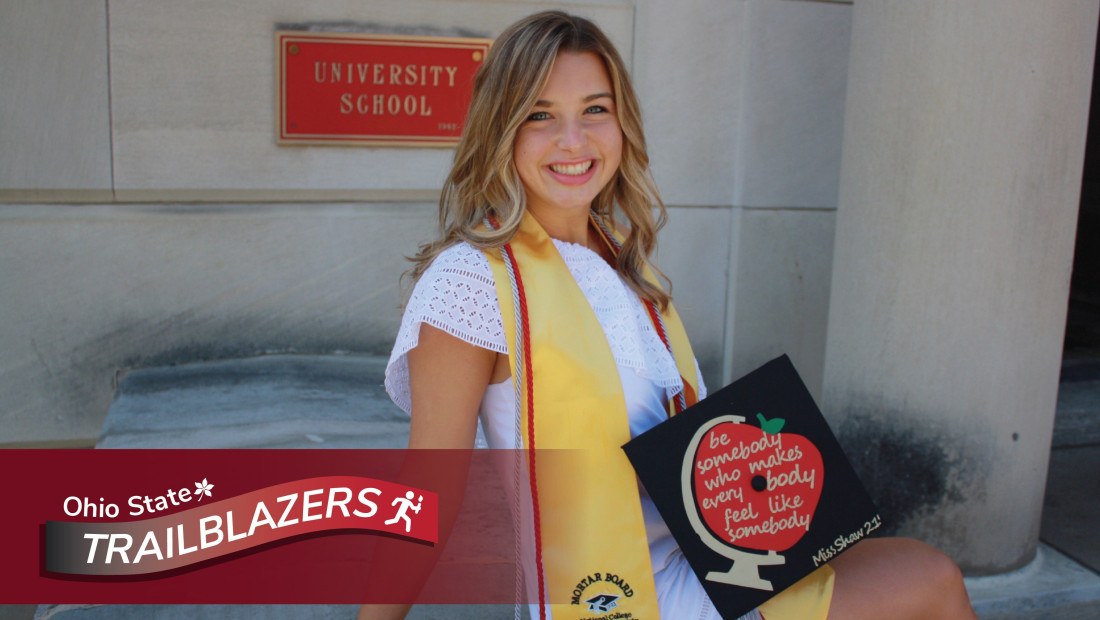 Emily Shaw posing with graduation cap with Ohio State trailblazers logo