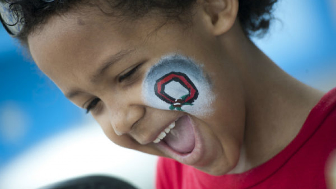 young child with osu face paint