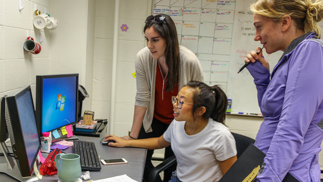 Perez working with student