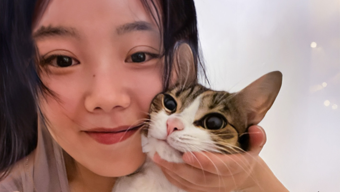 Woman holding her pet cat