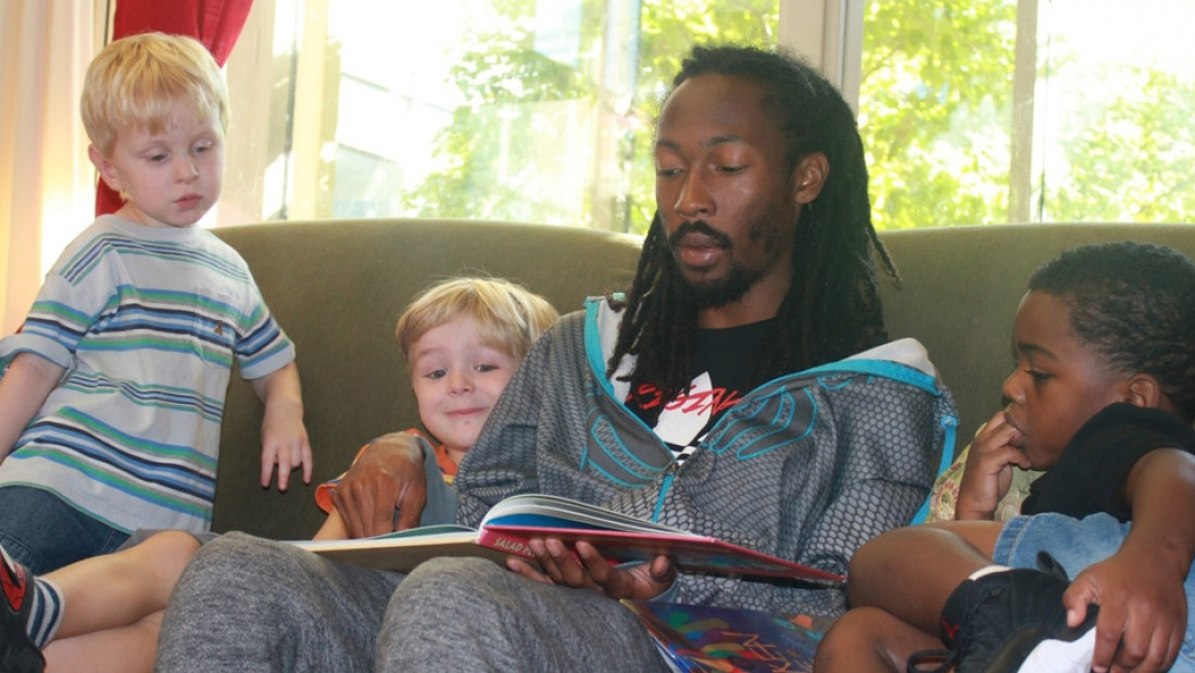 Man reading to preschoolers