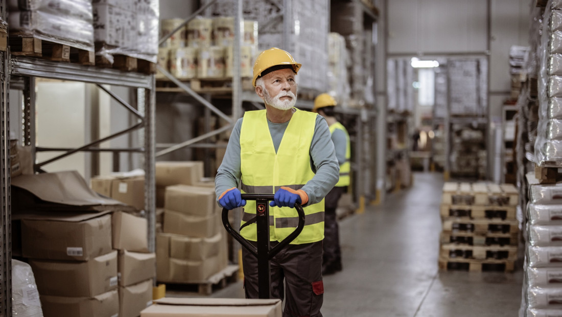 Senior man working in a warehouse