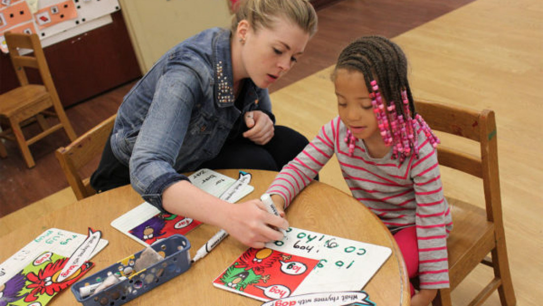 teacher with preschool student