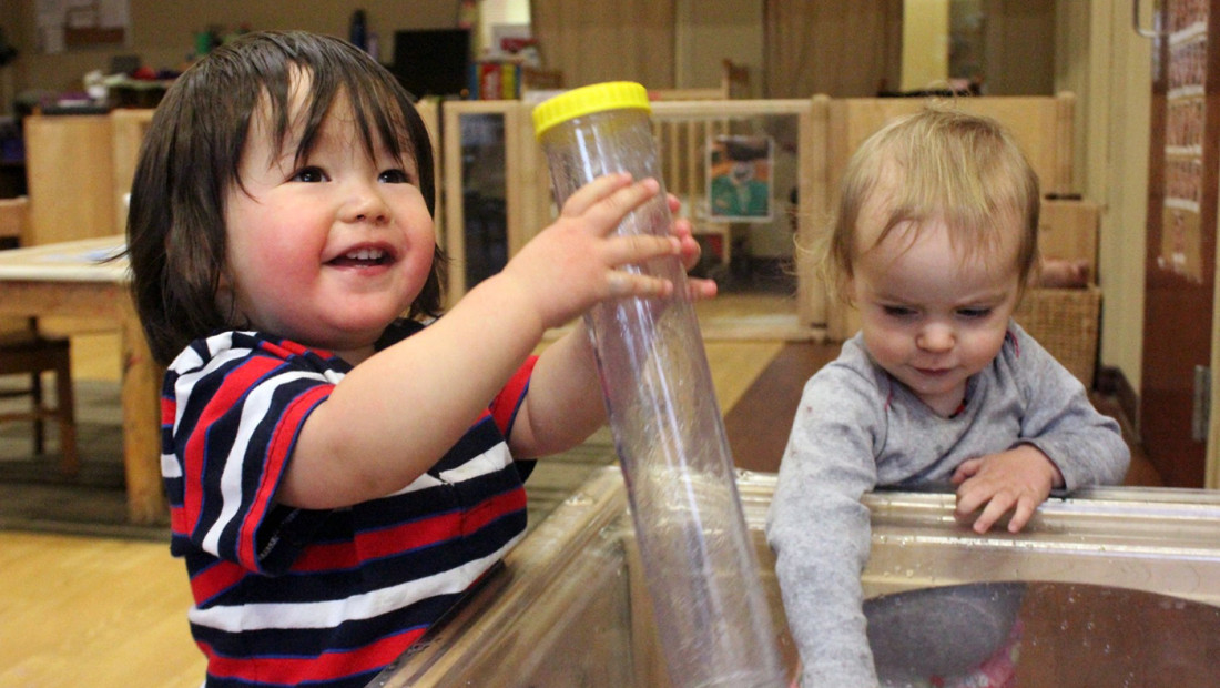 Children playing in a classroom at the Crane Center