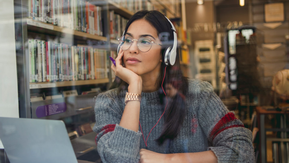 woman studying with headphones on
