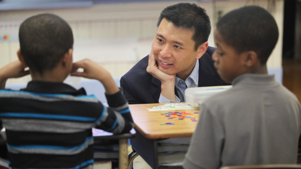 teacher talking with students