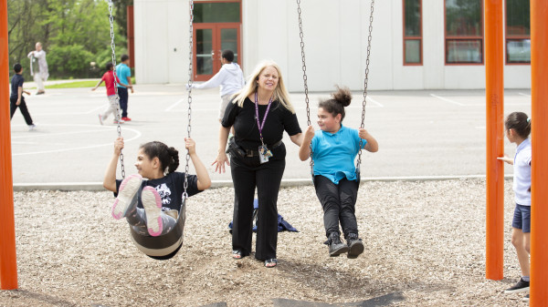 Mother on playground with children