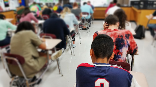 Student in class taking an exam