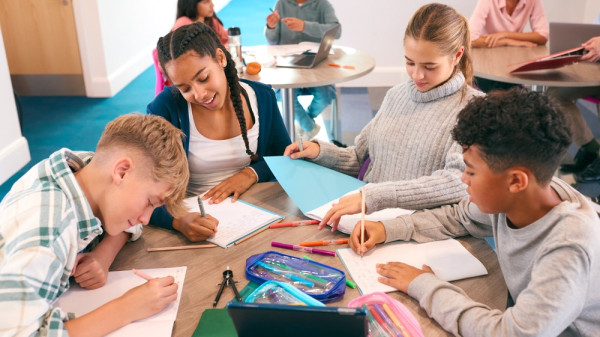 Teachers working with students in a classroom
