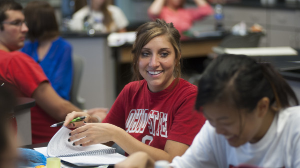 Ohio State students sitting in a classroom reviewing class work