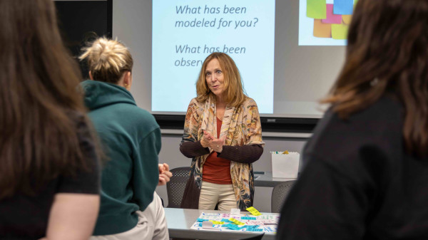 Ohio State faculty in front of classroom of students