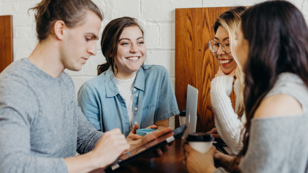 four people talking