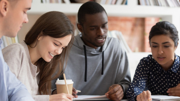 students sitting around a table studying