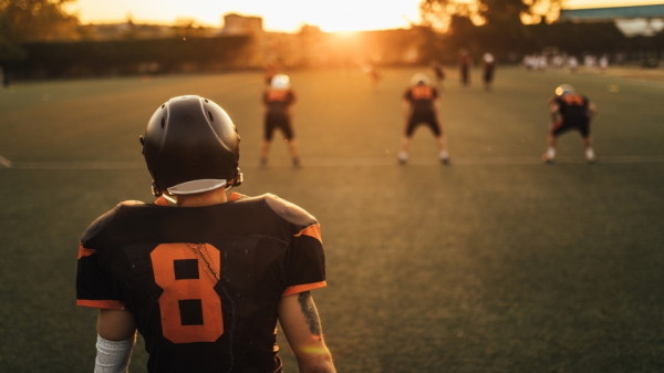 Football players at an early morning practice