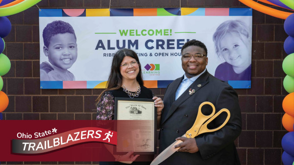 Gina Ginn with award with Ohio State Trailblazer icon overlay