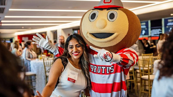 Hospitality Management student with Brutus the Buckeye