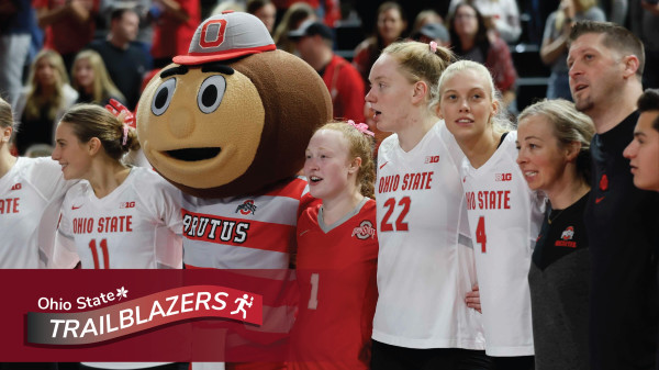Alumna Sarah Morbitzer with her Ohio State volleyball teammates and Brutus the Buckeye