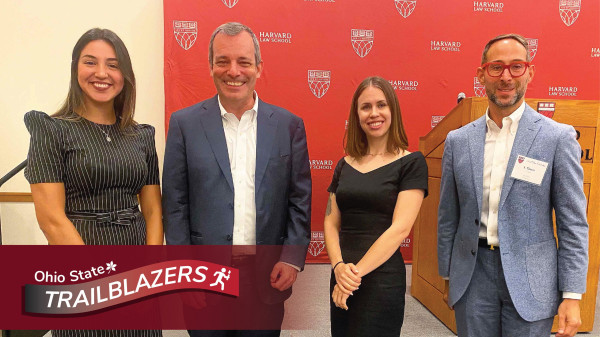 Kelly Capatosto and Harvard collegues with Ohio State Trailblazers logo