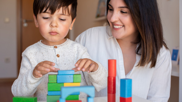 kid playing with blocks