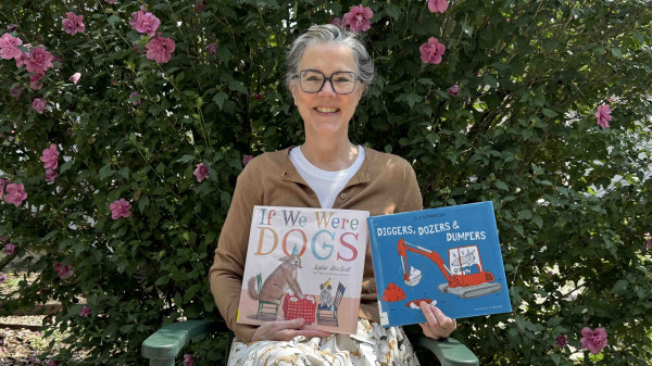 Lisa Pinkerton holding two picturebooks