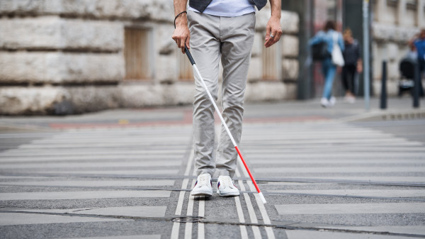 blind man with cane walk