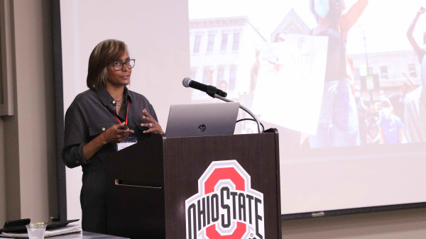 Ohio State podium with a speaker from Office of Faculty Affairs
